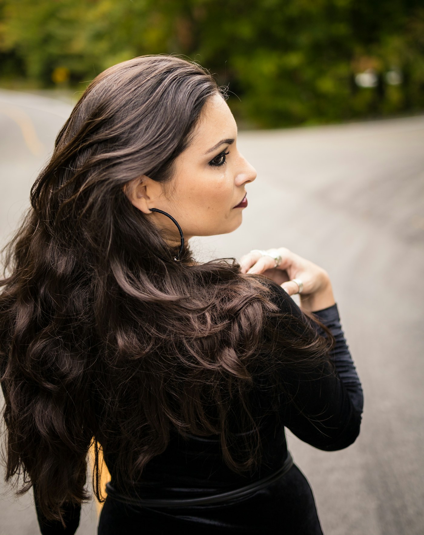 Long, glossy dark hair over the shoulder