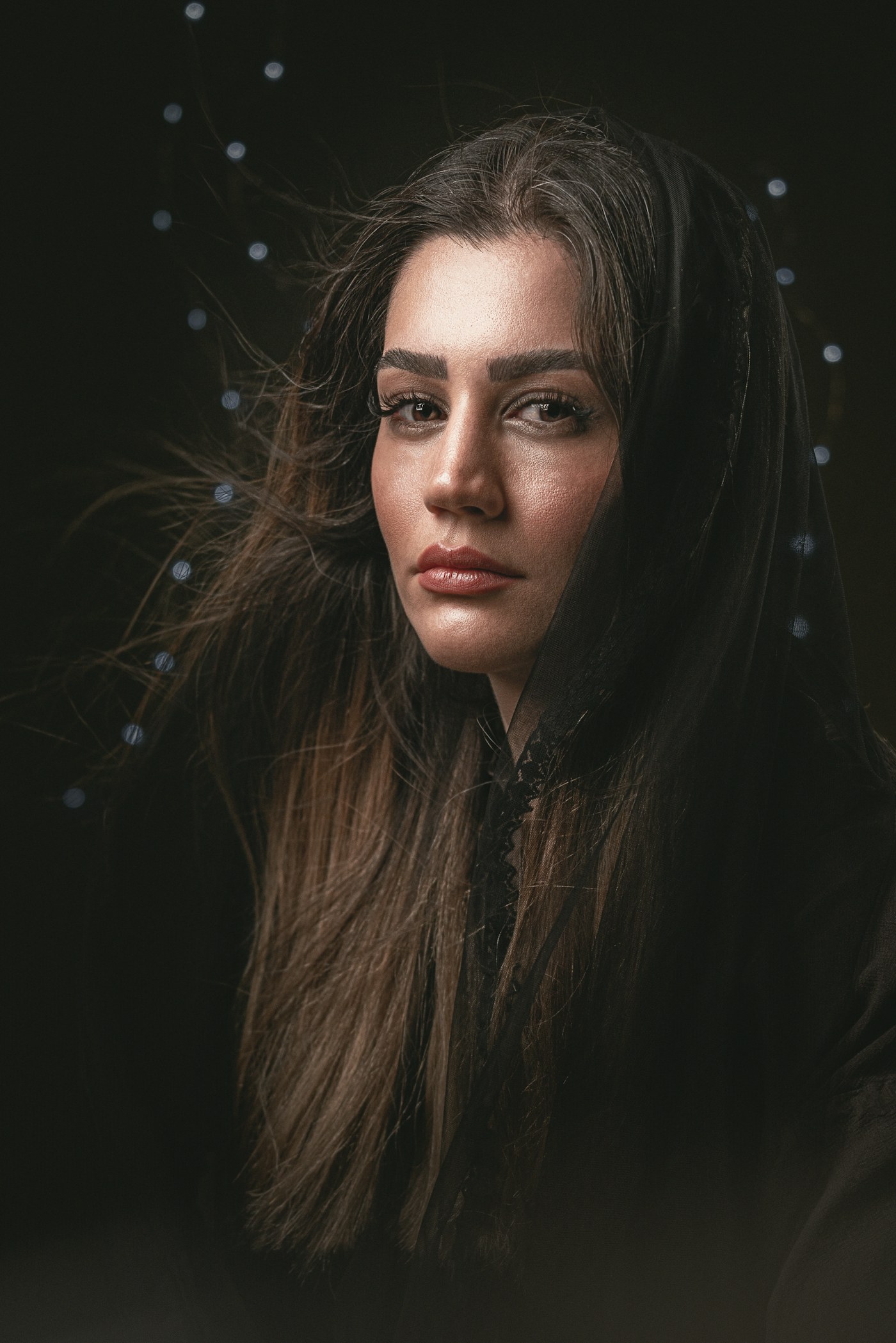 Woman with long hair looking at the camera
